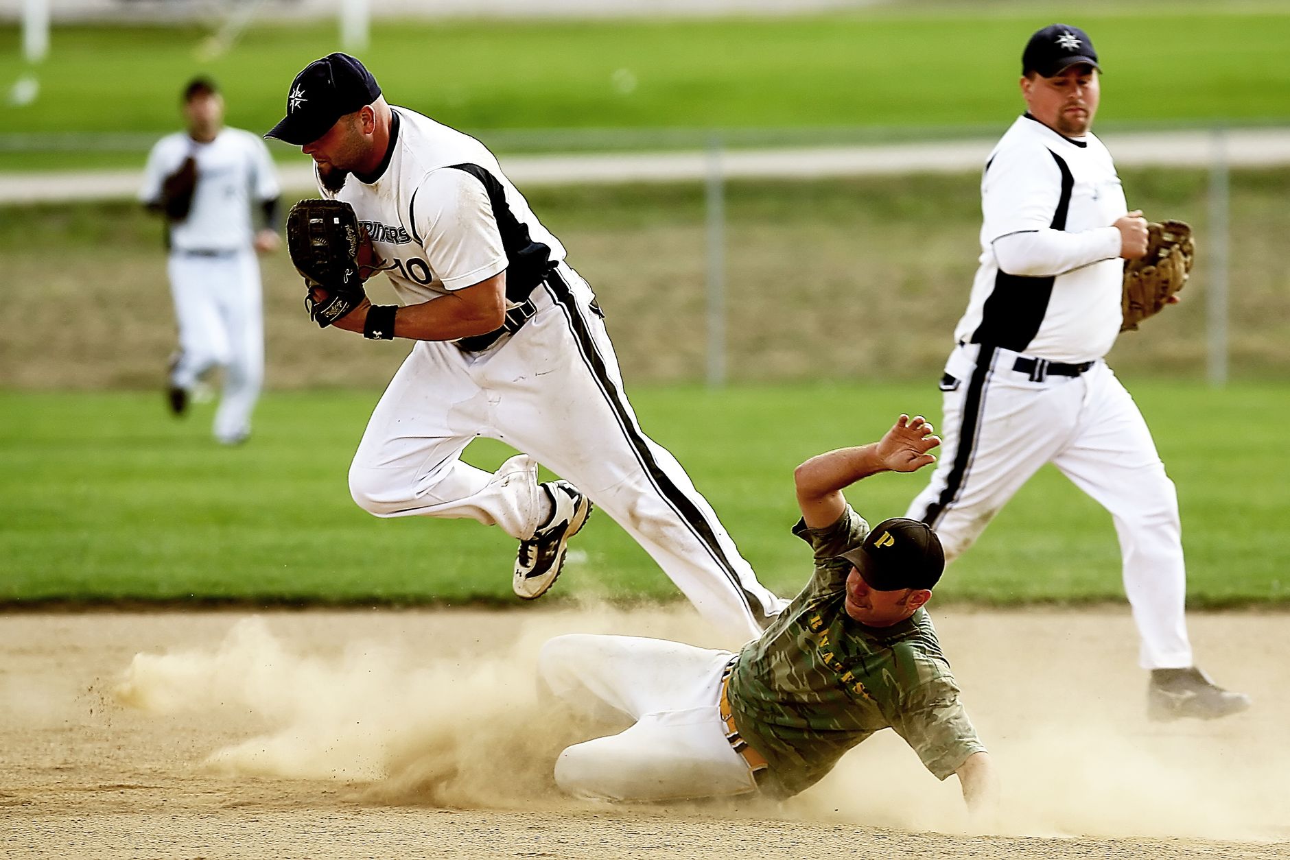 Young players training on a full-size baseball diamond