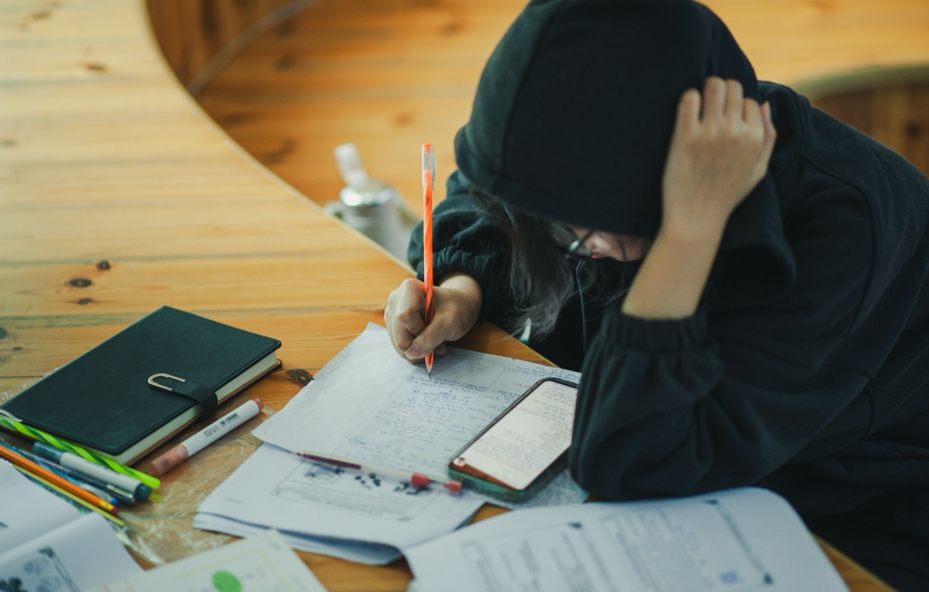 Young athlete balancing study and sport