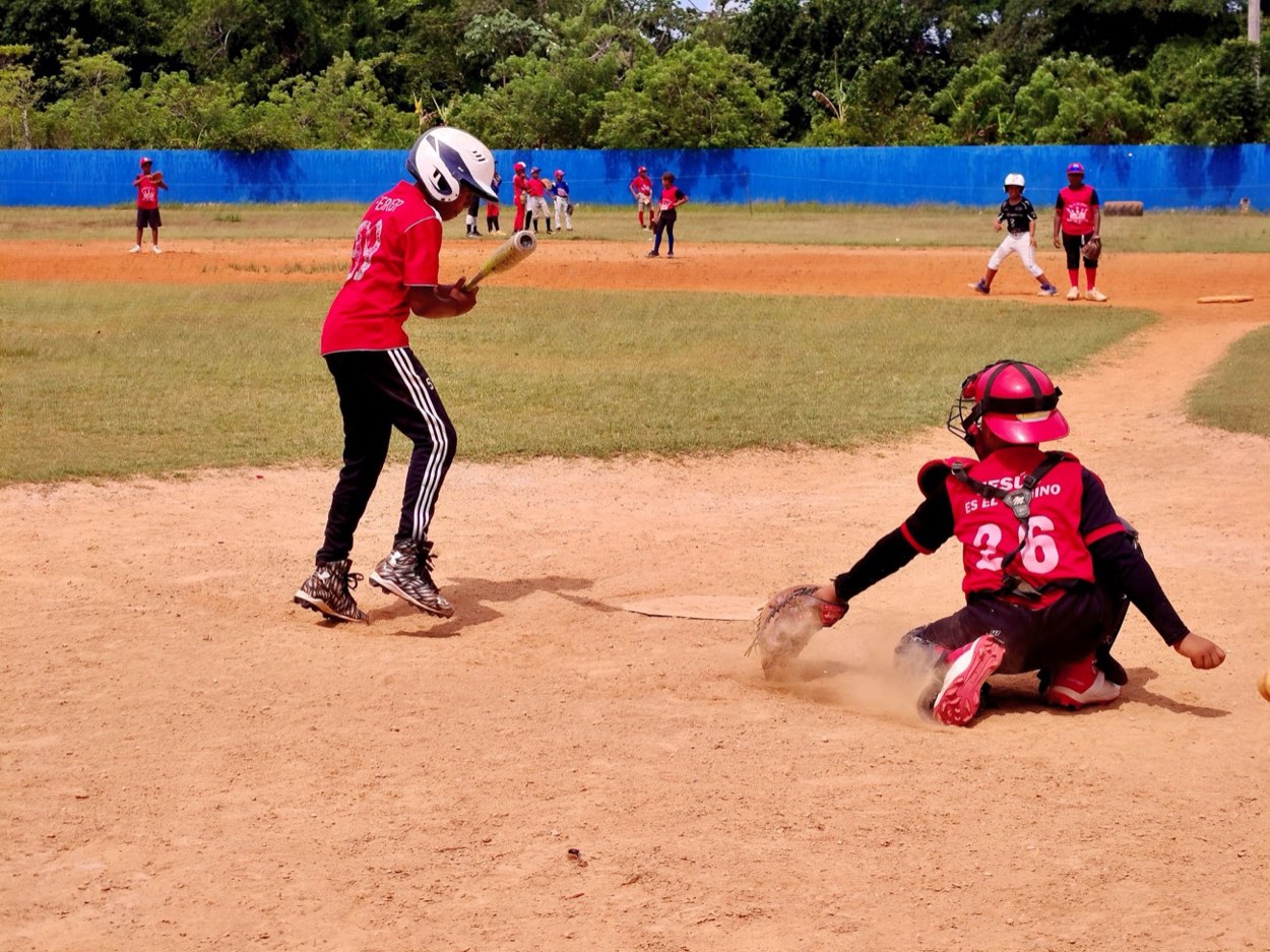 Third base coach giving signals