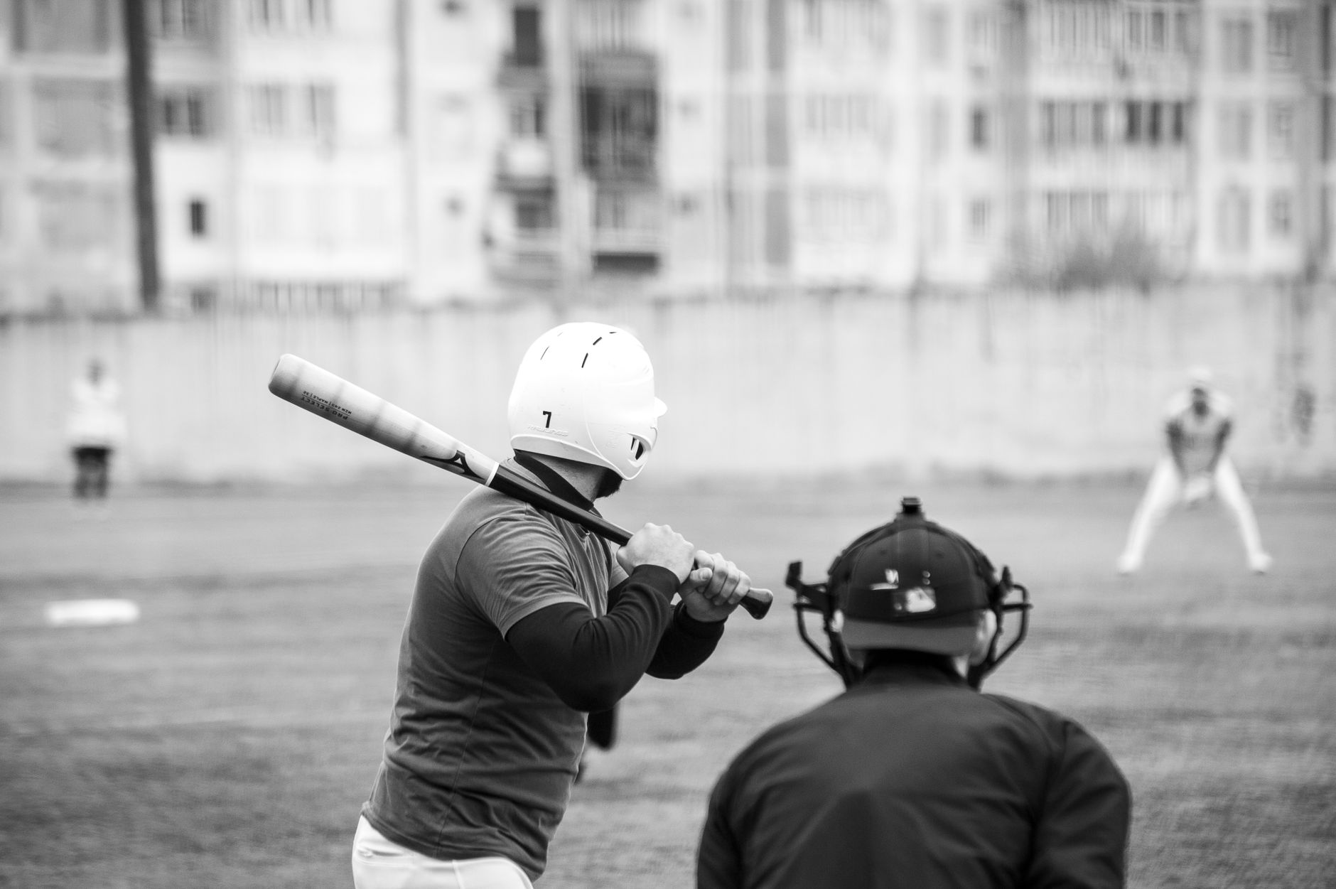 Player selecting a bat from the dugout