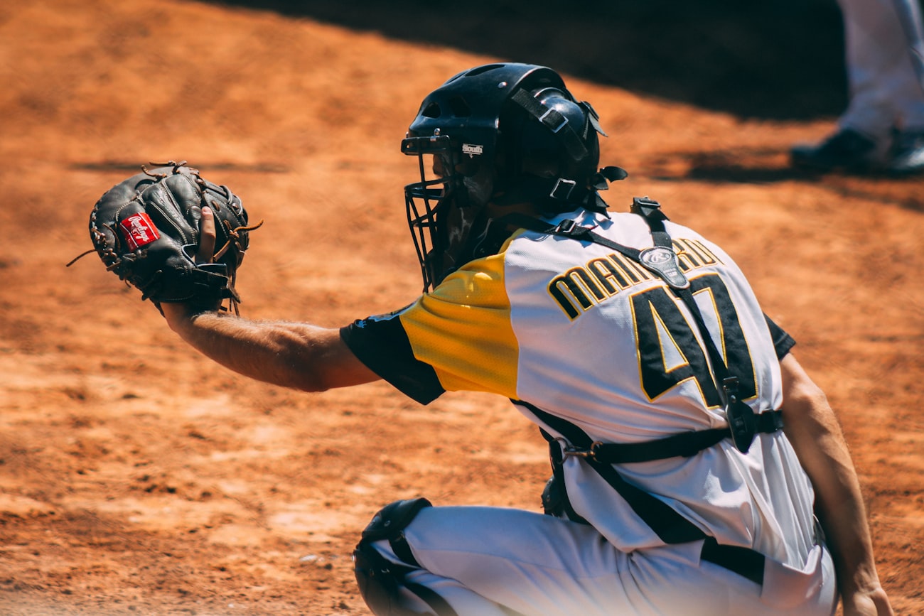 Catcher giving signs to the pitcher