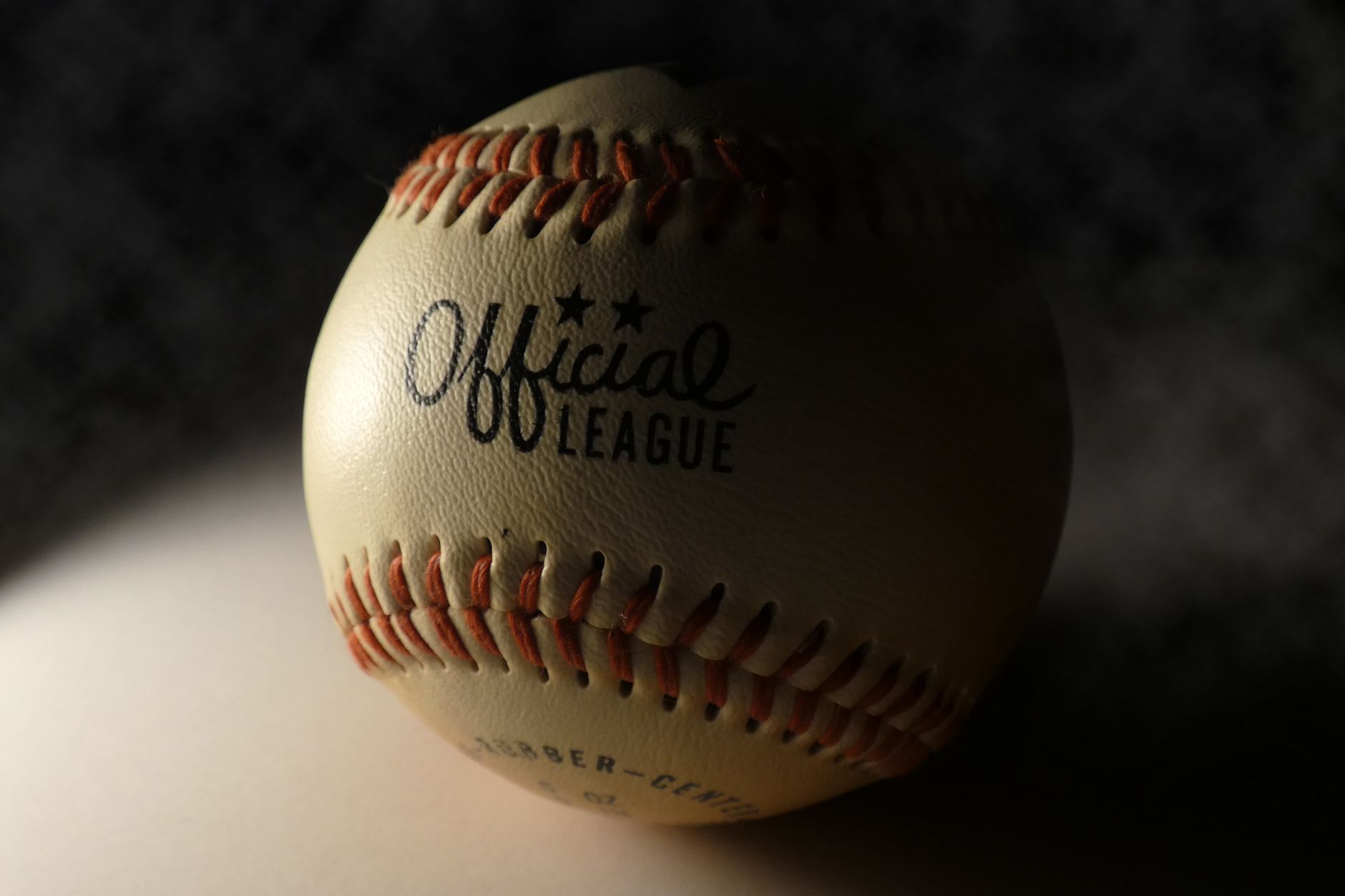 Baseball glove and ball on the infield dirt
