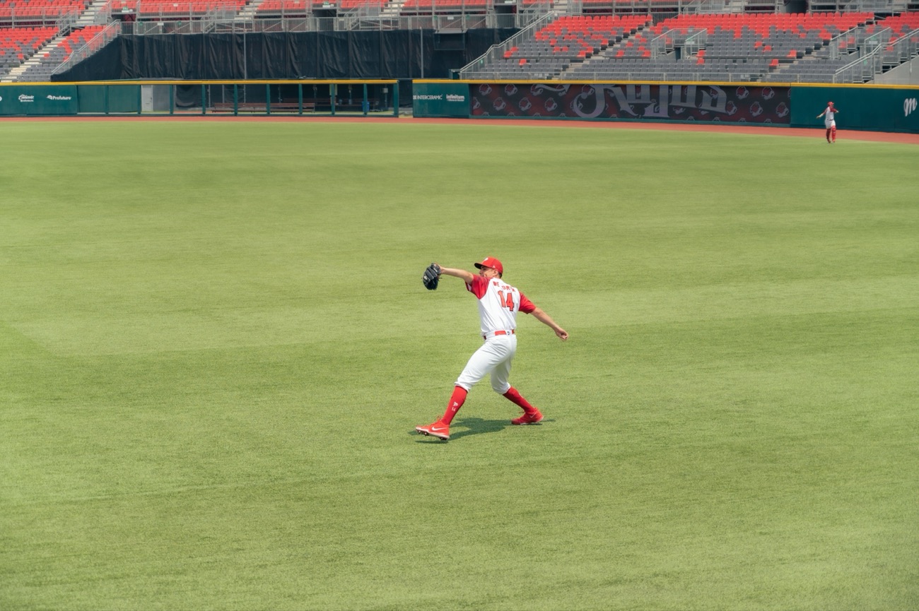Shortstop throwing across to first base