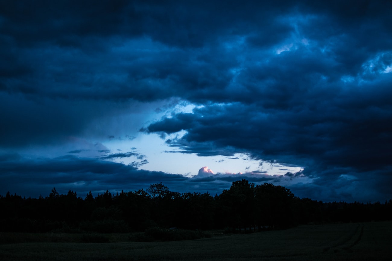 Storm clouds gathering over a sports field