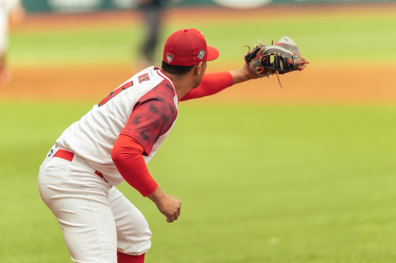Center fielder running down a fly ball