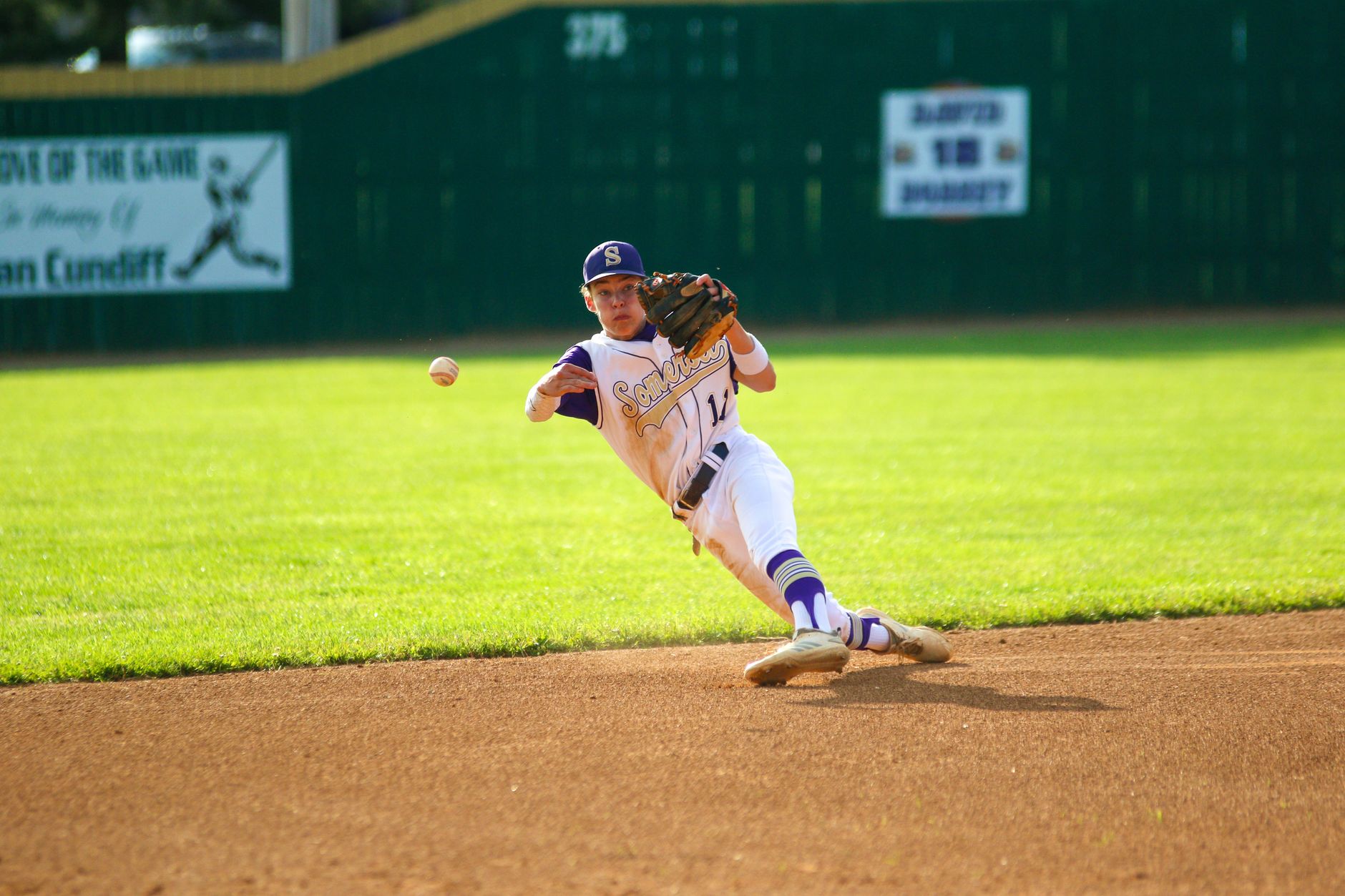 First baseman stretching for a throw at the bag
