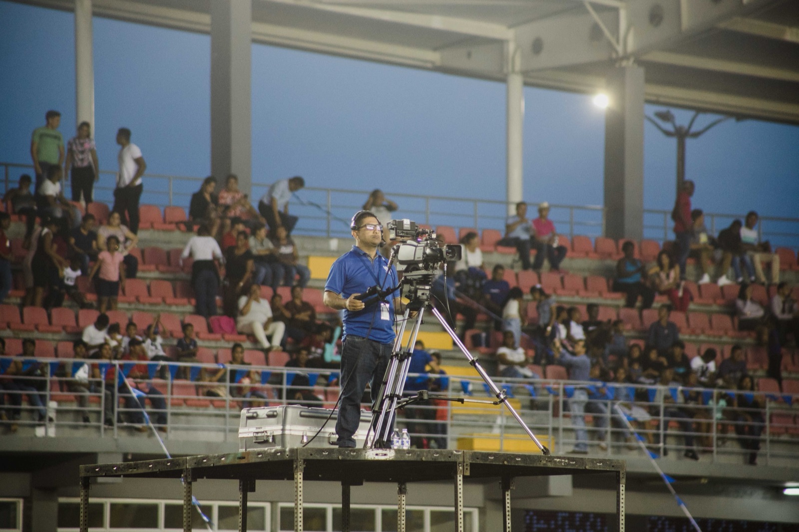Camera on a tripod filming a sports field