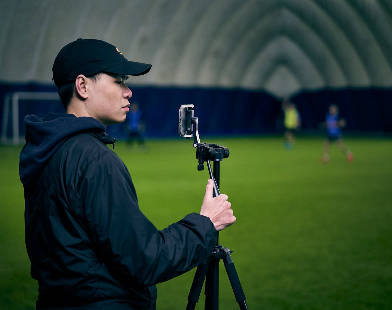 Coach reviewing video with a player on a tablet