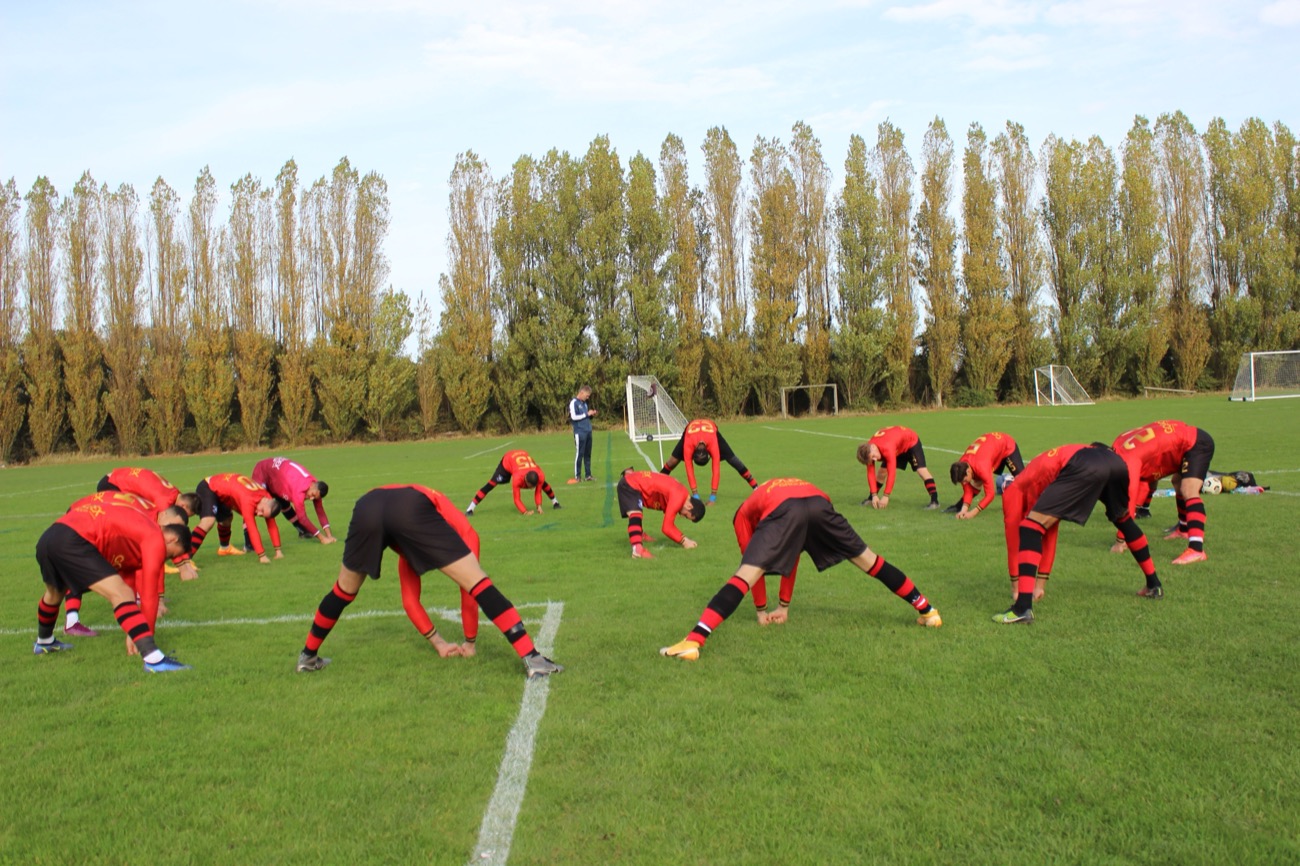 Players warming up with catch play