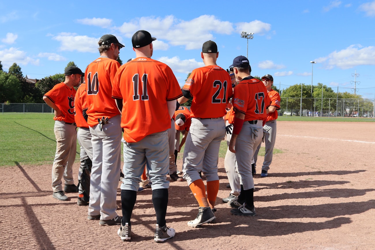 Teammates cheering from the dugout