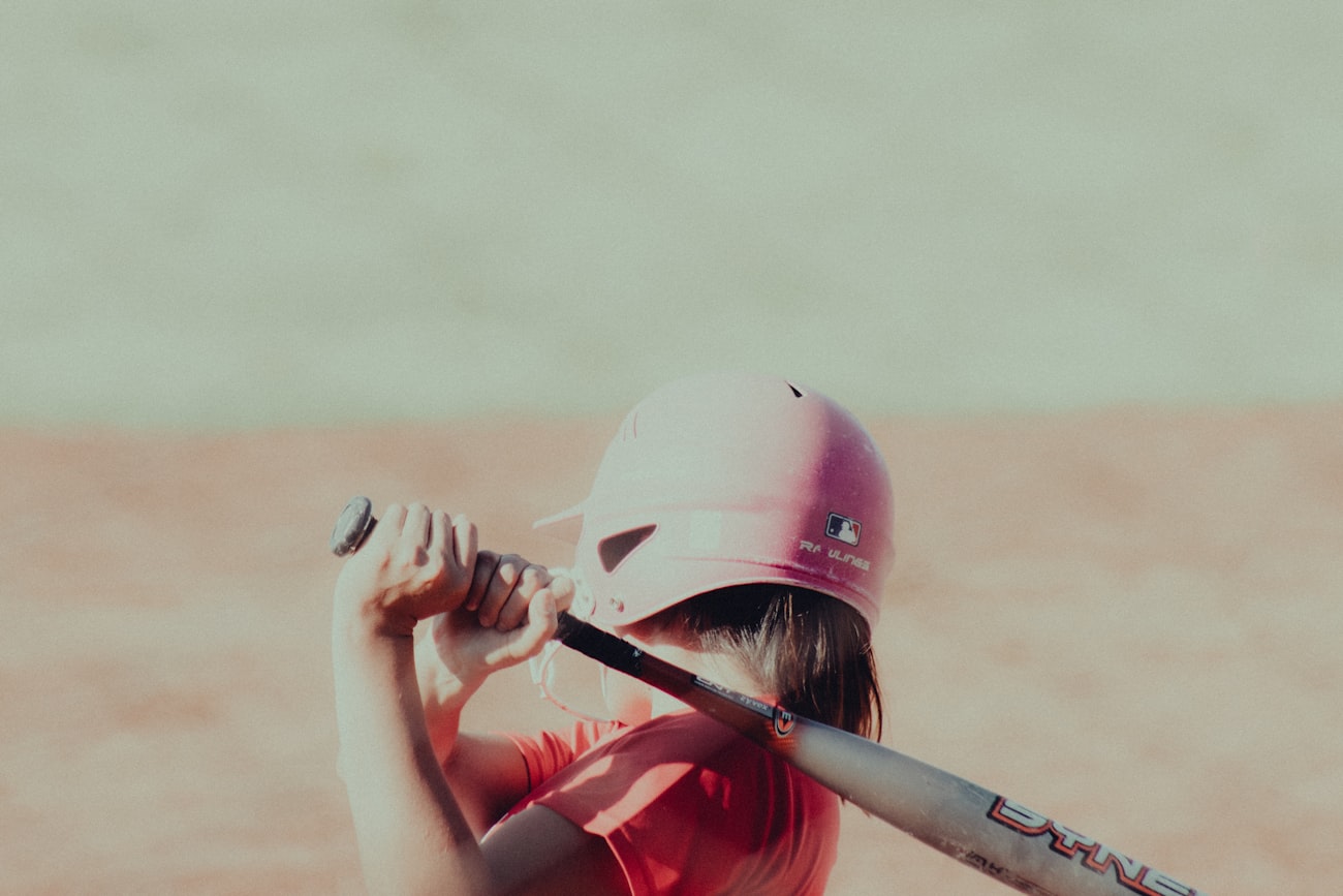 Young female athlete batting