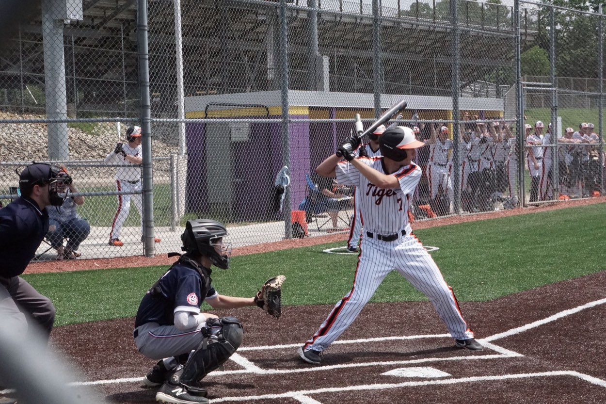 Players in a high school baseball dugout