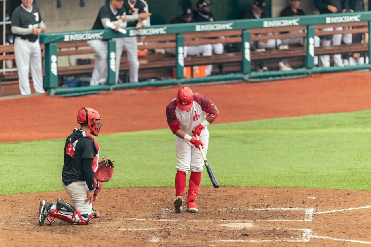 Coach signalling from the dugout