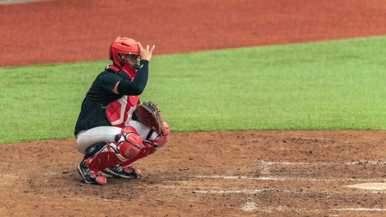 Pitcher and catcher meeting on the mound