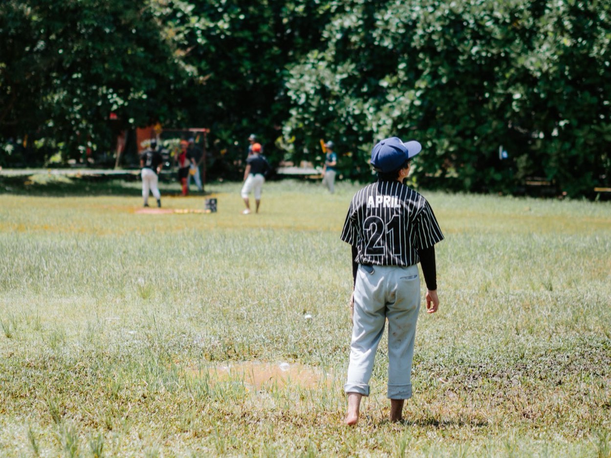 Coach talking with a young player about his role