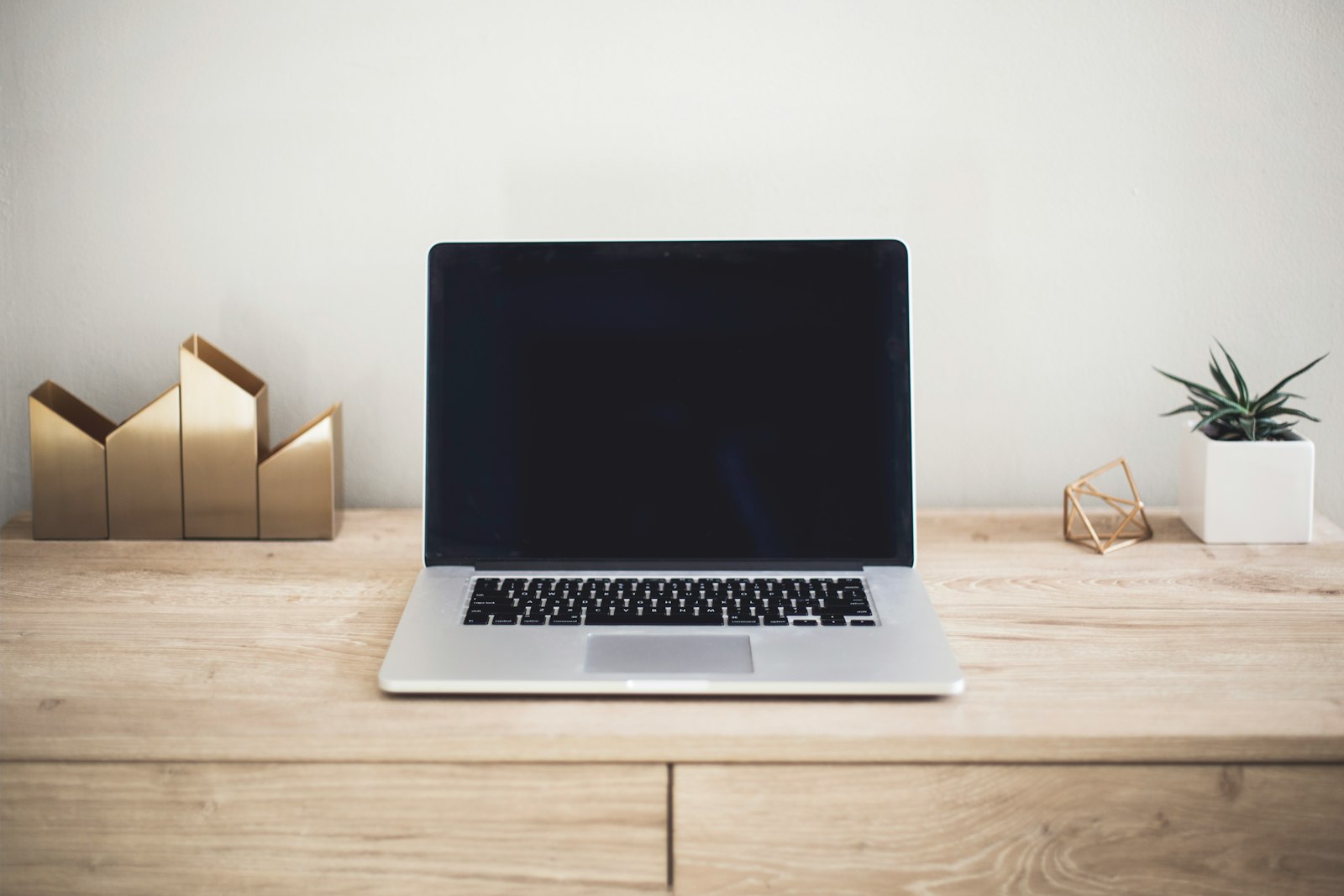 Working on recruiting emails at a laptop