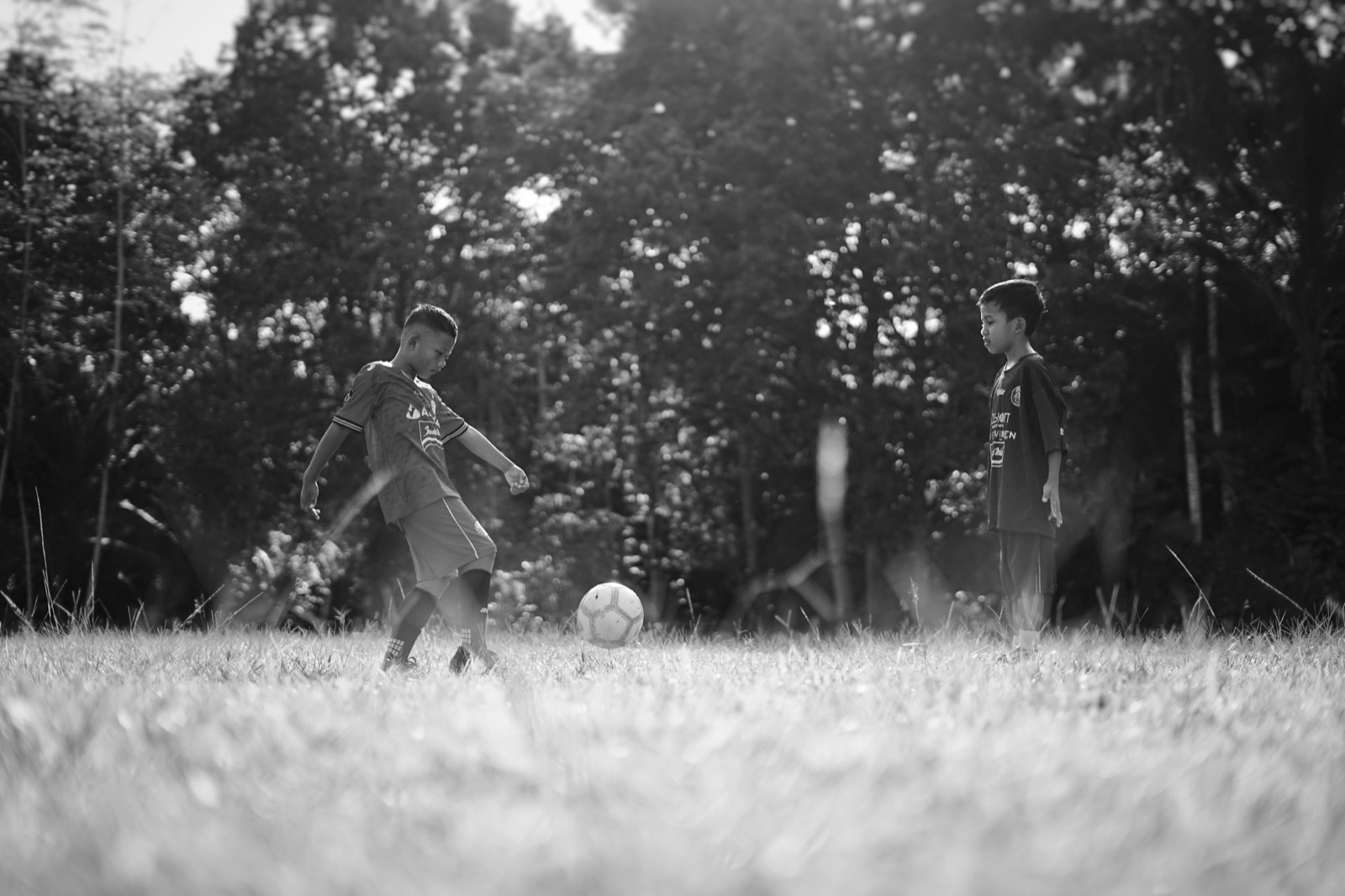 Siblings at a sports field