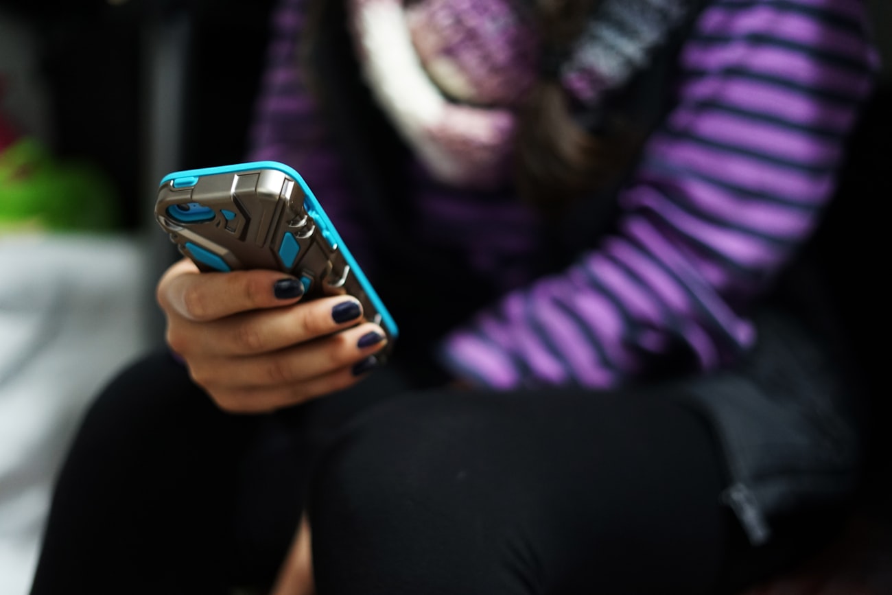 Teen checking their phone