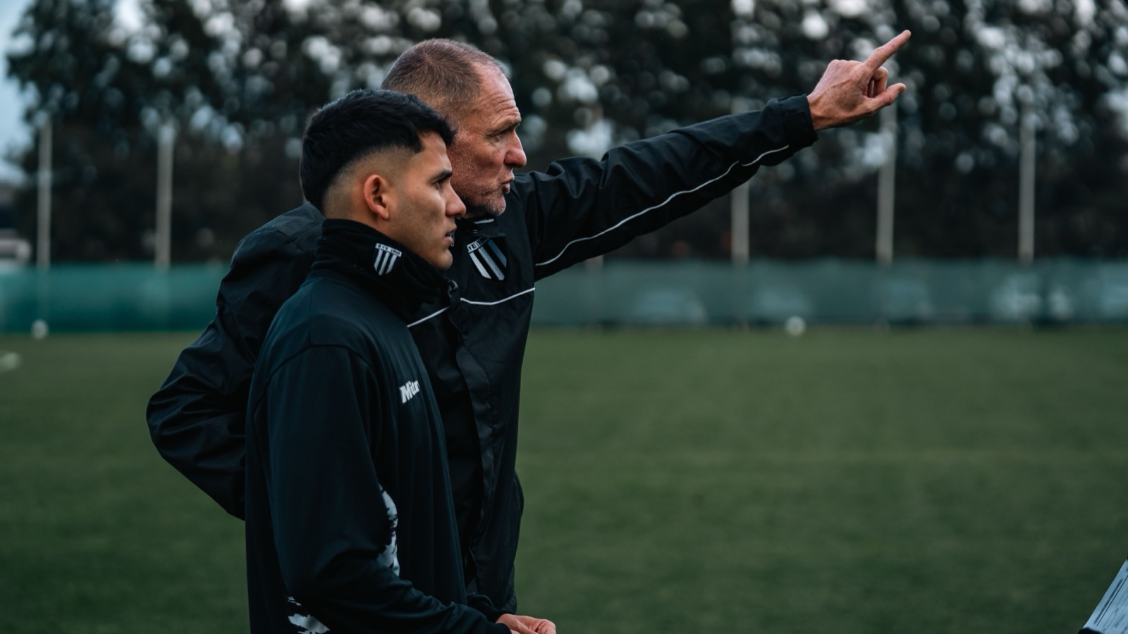 Coach talking one-to-one with a player