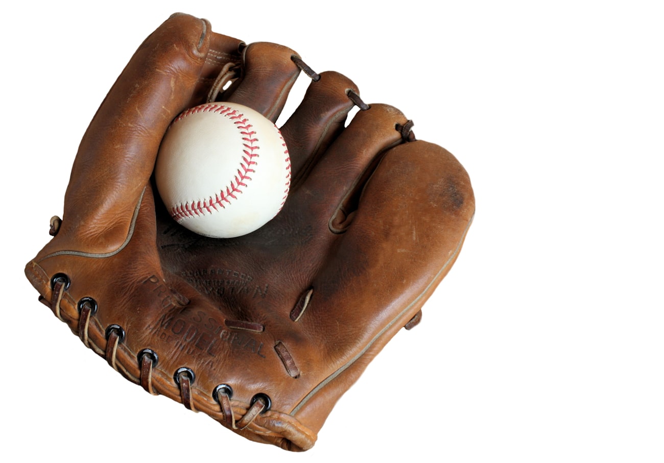 Baseball bats and gear bag on a dugout bench