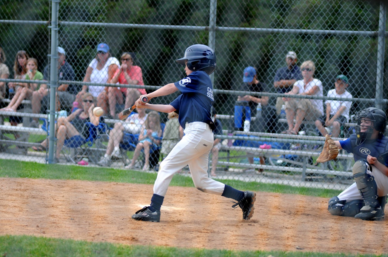 Young baseball players working through training drills