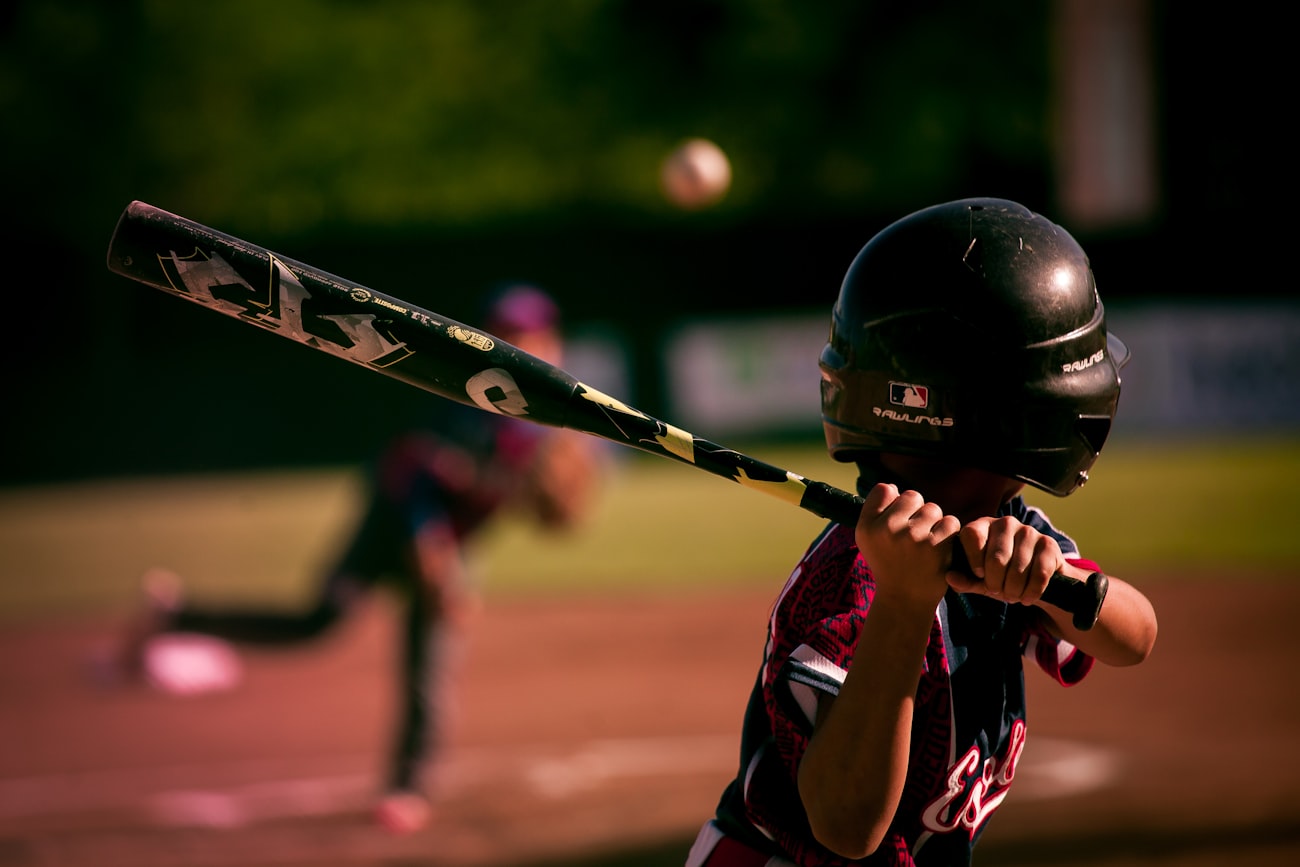 Youth baseball game in progress on a community field