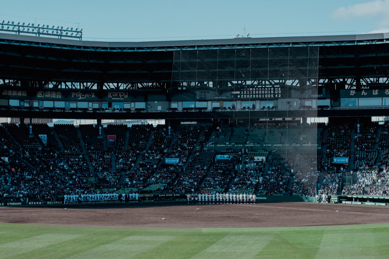 Baseball glove and ball resting on the infield dirt
