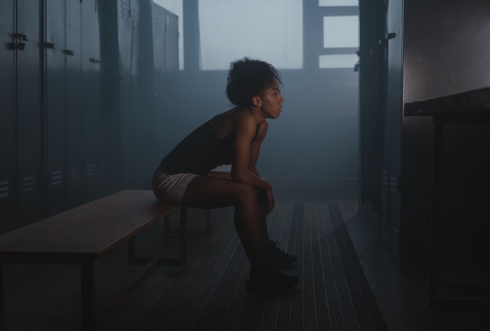 Young athlete sitting alone