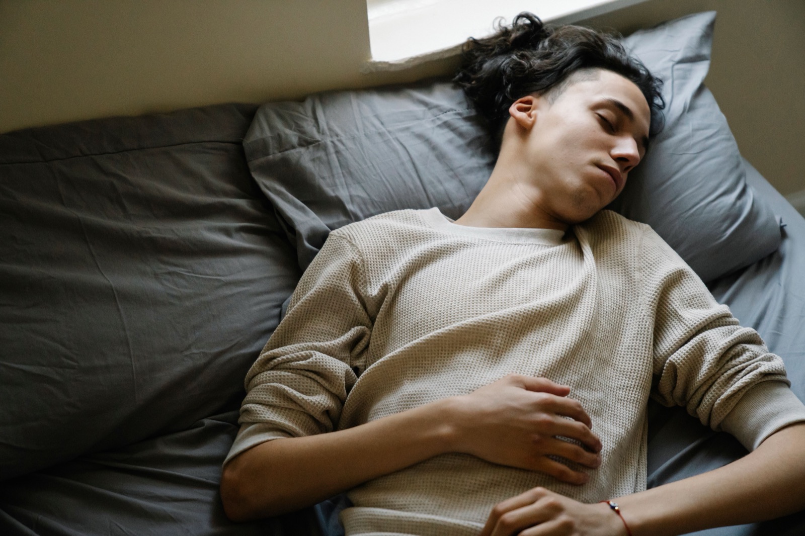 Teenage athlete sleeping and recovering