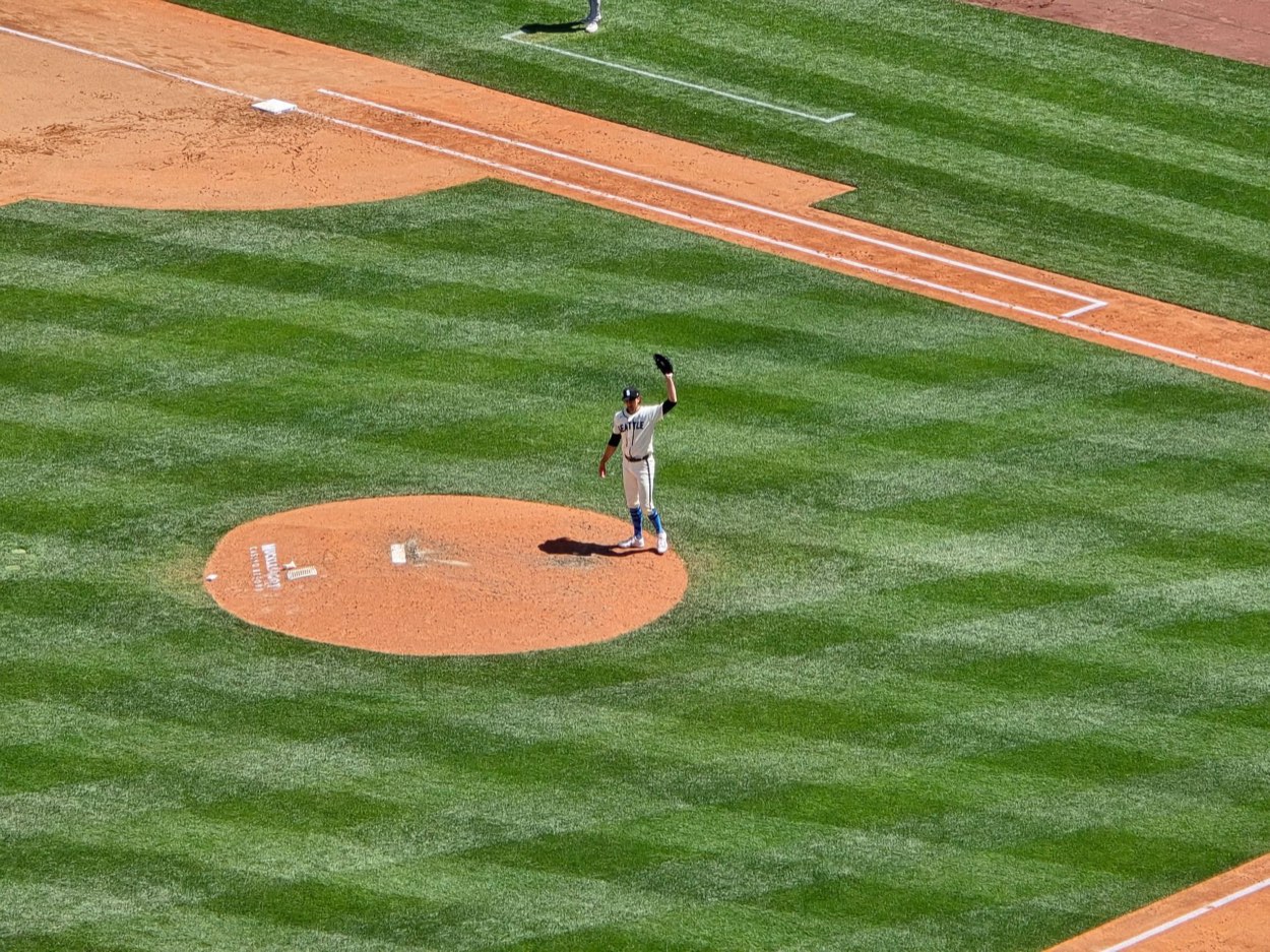 Baseball player warming up his throwing arm