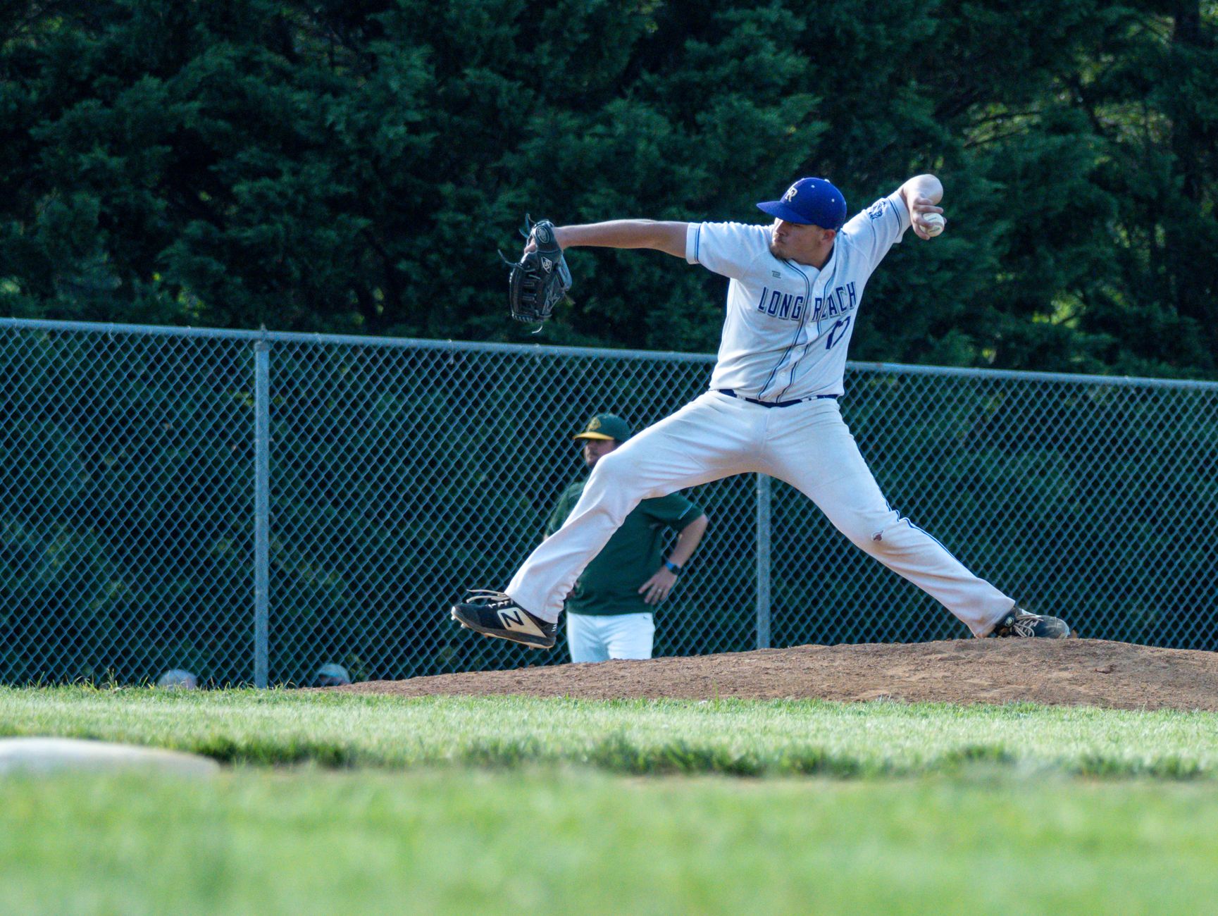 Player stretching before throwing