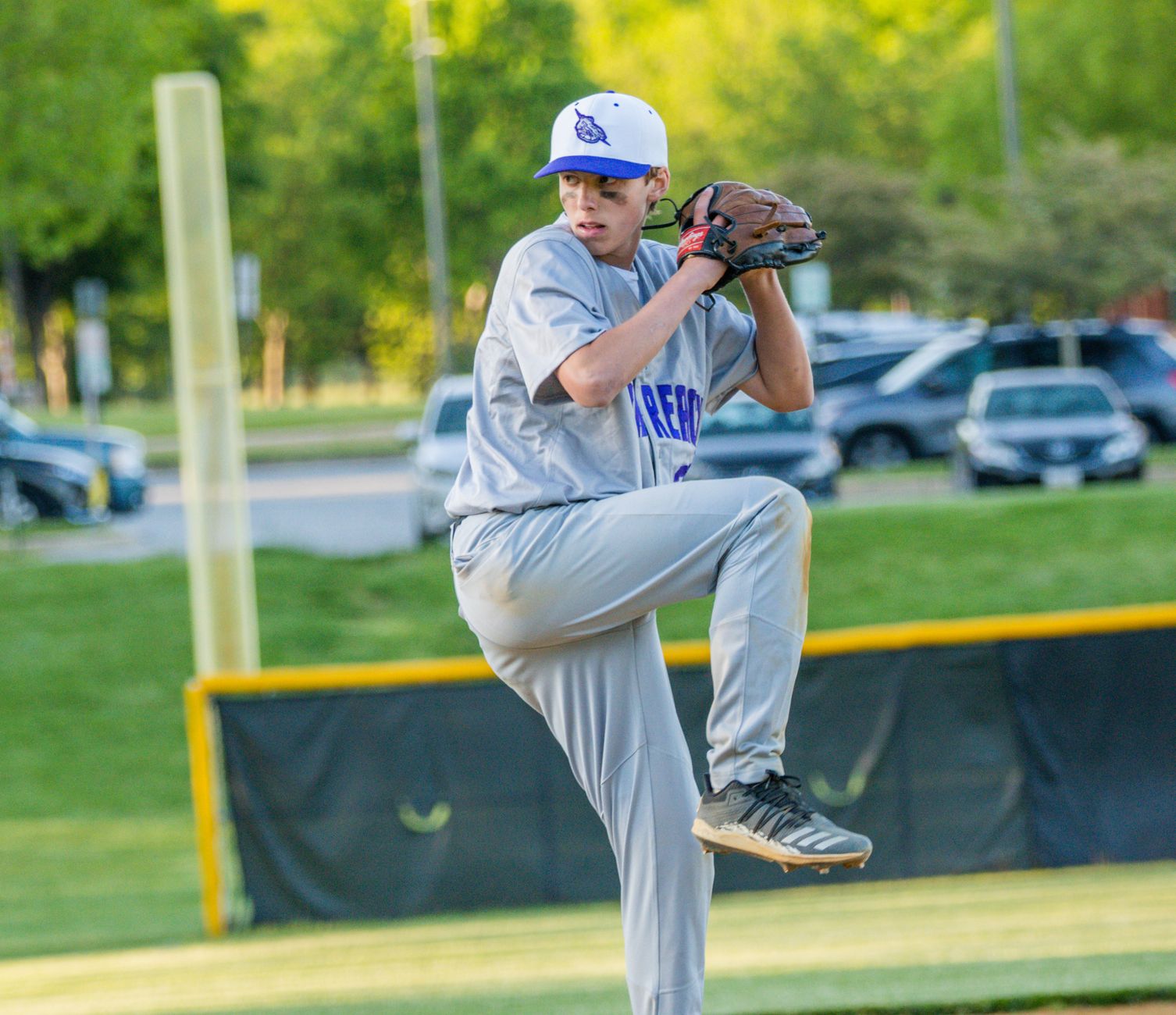 Young pitcher resting between innings