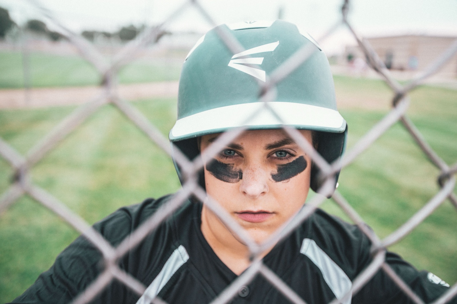 Batting helmet with a protective face guard