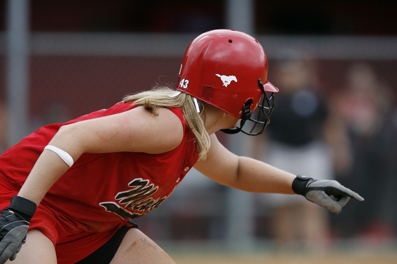 Player sliding feet-first into a base